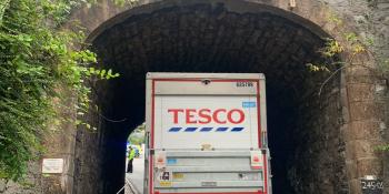 A Tesco lorry stuck under a bridge in Plymouth