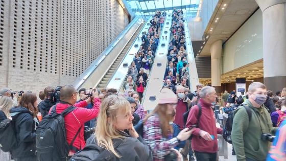 Crowds descend the escalator for the first train on the Elizabeth Line's opening day at Paddington, 24 May